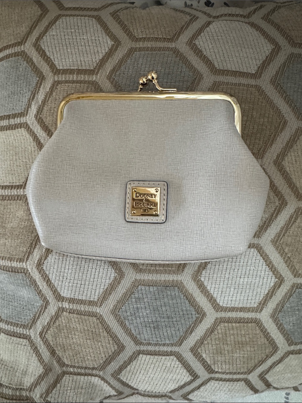 Dooney & Bourke Cream Clasp Frame Wristlet with Gold Tone Hardware